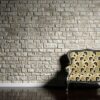 retro sofa on the background of an old brick wall