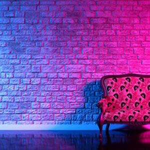 retro sofa on the background of an old brick wall in the enon li