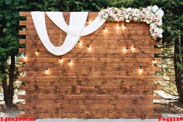 rustic wooden wedding arch with retro garland decorated with flowers for wedding ceremony newlyweds