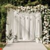 wedding ceremony arch decor with white roses and green outside