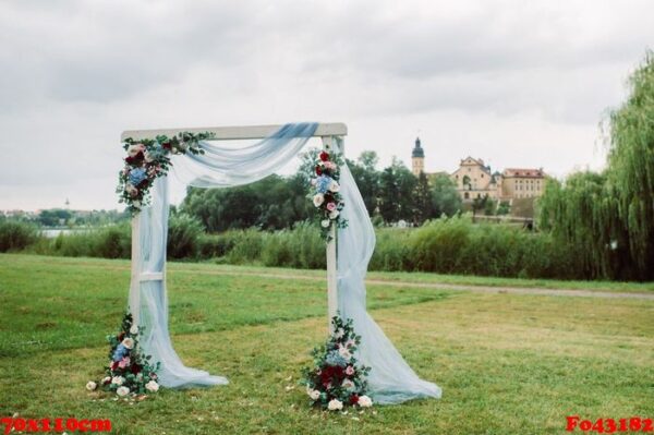 wedding ceremony on the street on the green lawn.decor with fresh flowers arches for the ceremony