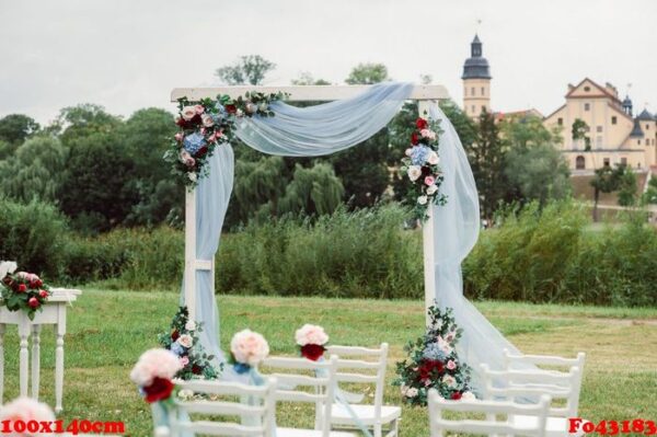 wedding ceremony on the street on the green lawn.decor with fresh flowers arches for the ceremony