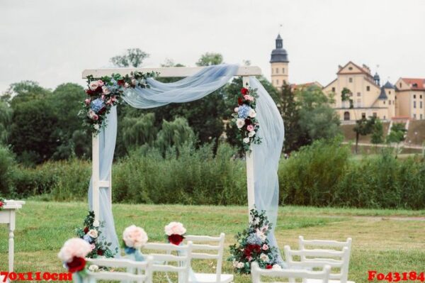 wedding ceremony on the street on the green lawn.decor with fresh flowers arches for the ceremony