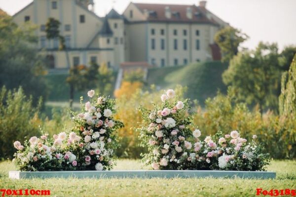 wedding ceremony on the street on the green lawn.decor with fresh flowers arches for the ceremony