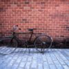 antique bike with red brick background. vintage concept