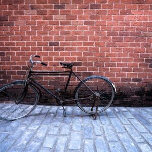 antique bike with red brick background. vintage concept