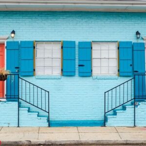 beautiful color scheme of staircases leading to apartments with similar doors and windows