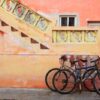 bicycles on grunge tropical caribbean orange facade