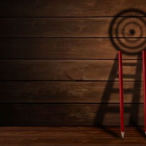 pencil and stair with target board shadow on wooden background ,