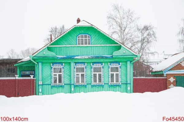 a russian wood house covered in snow