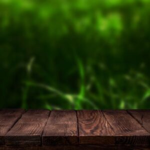 scene creator. mockup. empty wooden deck table with summer bokeh background.