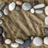 frame of stones on a background of sand closeup