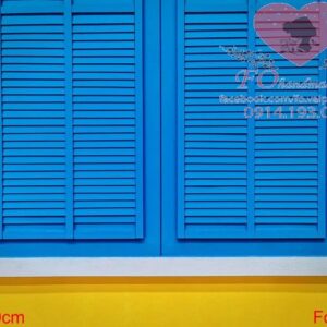 blue vintage wooden window with white frame on vivid yellow wall