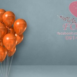 orange balloons bunch on a grey wall background. horizontal banner.