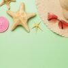 beach accessories, decorative starfish and lollipop on a green b