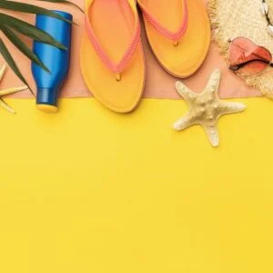 beach accessories, palm leaf and decorative starfish on colored