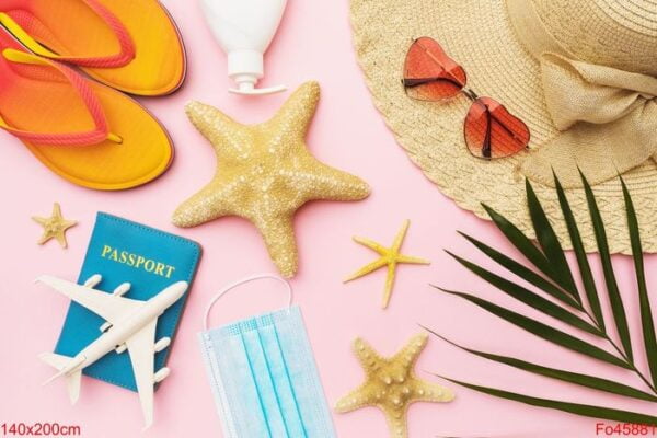 flat composition with beach holiday accessories, toy plane and p