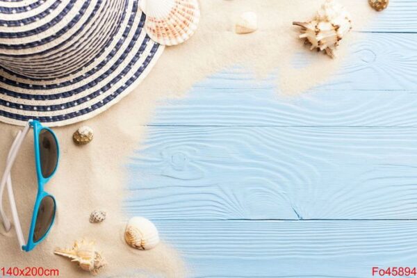 marine concept. beach accessories, sand and seashells on blue wooden table