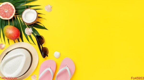 yellow background with summer accessories. travel and lifestyle concept, copy space.