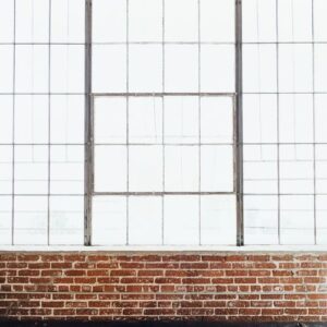 brick wall with big glass window interior background