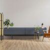 mock up cabinet in modern living room with leather armchair and plant on white wall background.