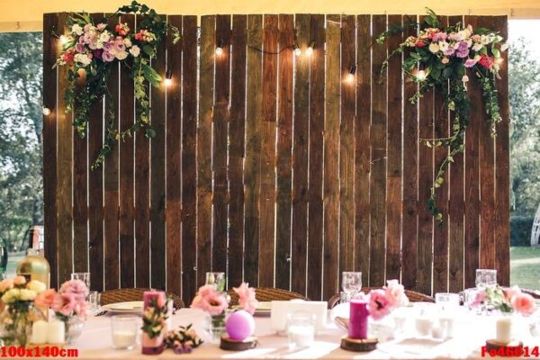 wedding venue. wooden wall at the banquet table with lamps and flowers. copy space