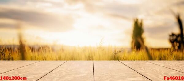 wooden table with blurred background of field of wheat. product display