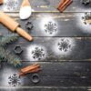 christmas composition with cookie cutters and flour on dark wooden background