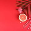 beach accessories with shells and sea stars on a colored background