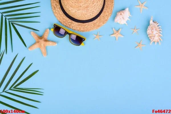 beach accessories: glasses and hat with shells and sea stars on a colored background