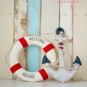 composition on the marine theme with anchor and lifeline on wooden background