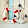 composition on the marine theme with anchor and lifeline on wooden background