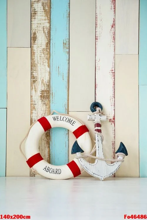 composition on the marine theme with anchor and lifeline on wooden background