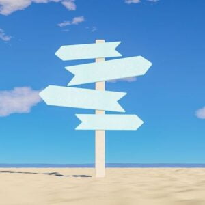 multidirectional sign on beach sand