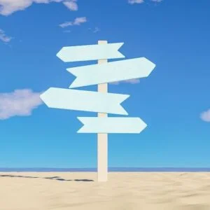 multidirectional sign on beach sand