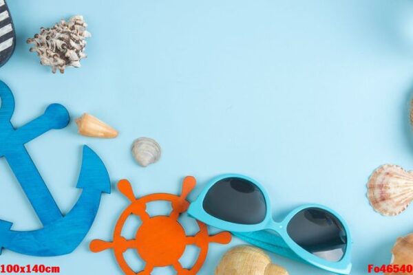 summer accessories with sun glasses and shells, on a bright blue background. free space. top view. frame