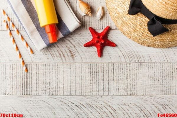 summer background. hat, seashells, sunscreen on a wooden background. copy space.