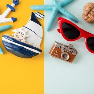 summer holiday travel concept on yellow and blue background