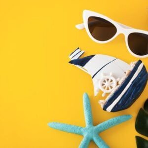 summer travel on yellow background