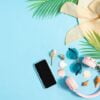 top view photo of beach accessories on a blue background