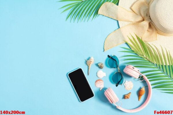 top view photo of beach accessories on a blue background