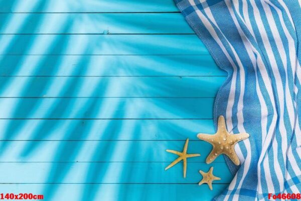 towel and starfishes on blue wooden background with copy space a