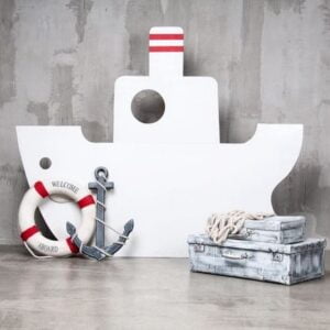 wooden boat on a gray background with an anchor and a circle. traveling is waiting.