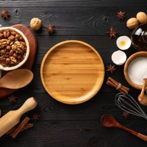 cooking delicious buns with cottage cheese for breakfast, ingredients on wooden background, flat lay