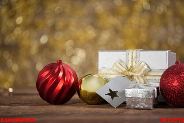 wrapped gift box and baubles on wooden table