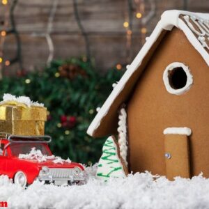 gingerbread house and toy car arranged together