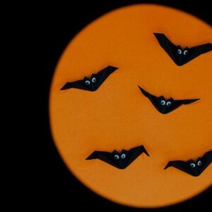 the halloween origami (or paper folding) of bats isolated on ora