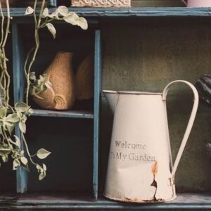 garden tools and flowerpots on wood shelf background with vintage feel