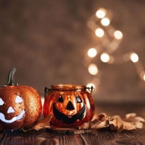 halloween pumpkin with candlelight and bokeh background.