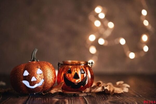 halloween pumpkin with candlelight and bokeh background.